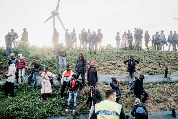 Migrants in Calais. "We come here because this is the only road to England," a Syrian man said. Credit Tom Jamieson for The New York Times